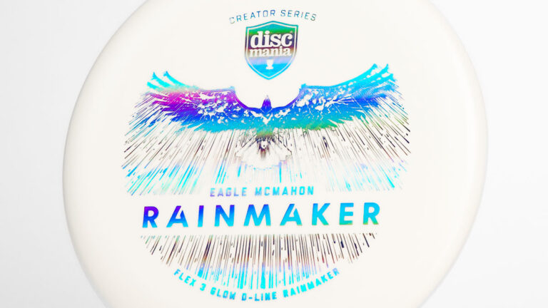 A white Discmania Rainmaker disc golf putter with a blue stamp.