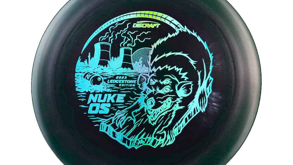 Discraft Lightweight ESP Nuke OS Dark Green color w/ light blue and green Holographic Stamp The disc features an image of a mutant rodent with four eyes, evoking the impression of an entity that emerged from a factory where hazardous substances were leaked.